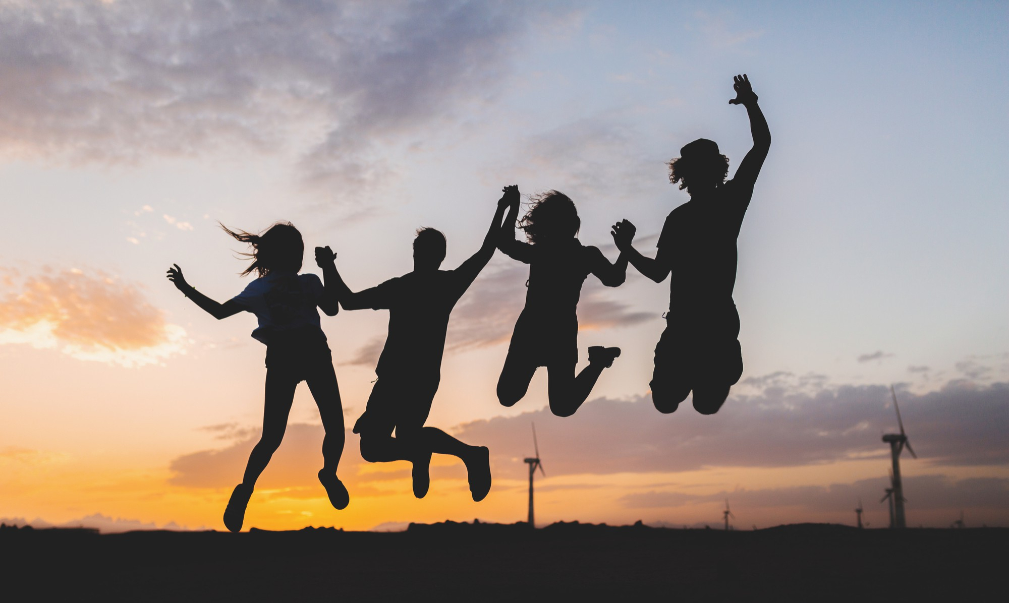happy-friends-silhouettes-jumping-sunset (1)